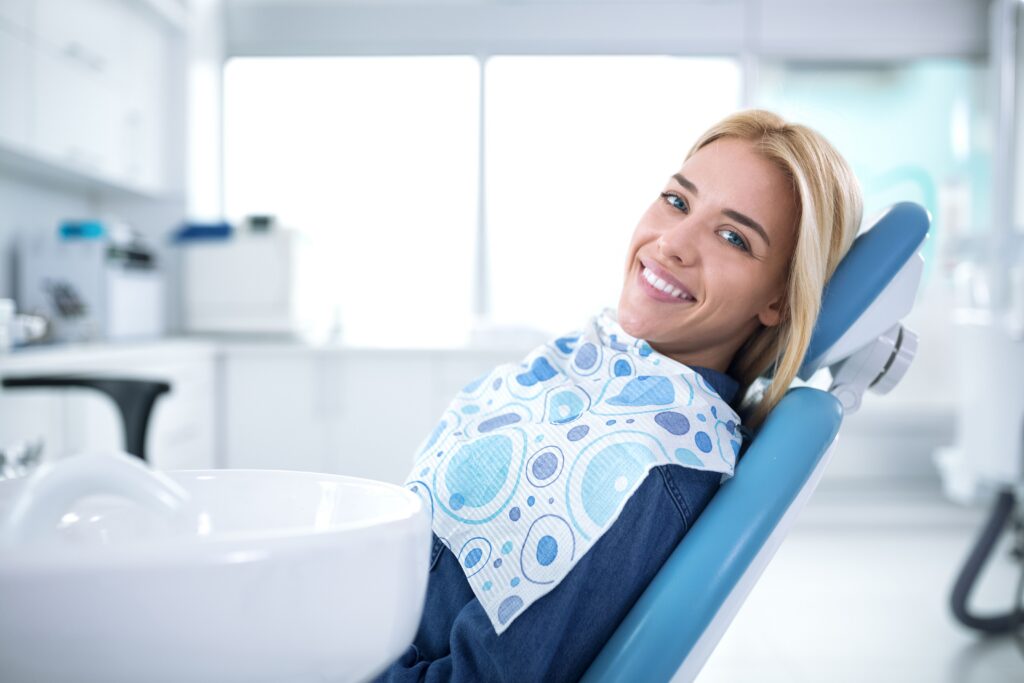Patient in a dental chair receiving preventive dental care at All Smile Care